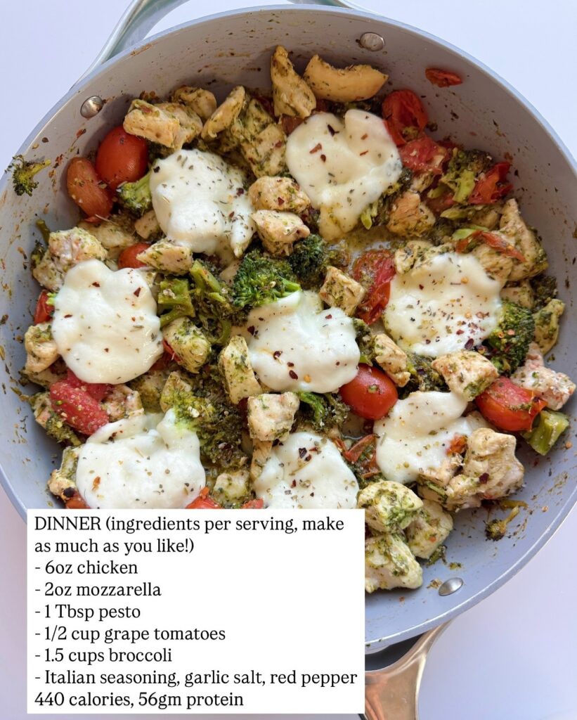 One-pan chicken with broccoli, tomatoes, pesto, and melted mozzarella with calorie and protein counts.