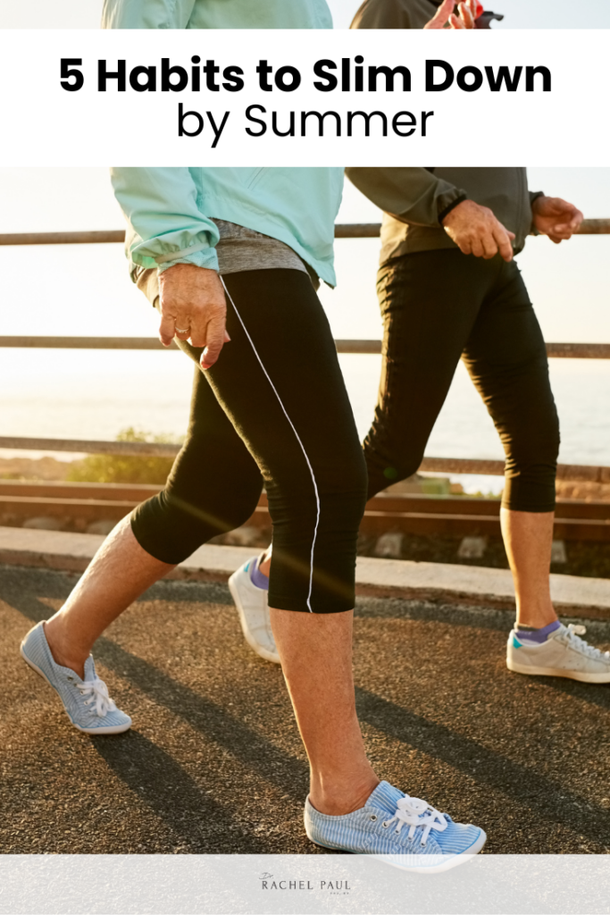 Two people walking outdoors on a paved path, with one person wearing a light blue jacket and the other a dark gray jacket. With text that says, "5 Steps to Slim Down by Summer."