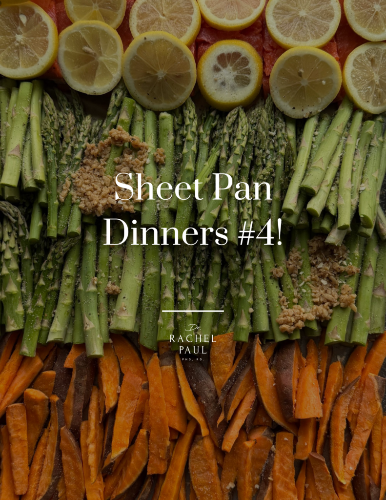 A close-up overhead view shows a colorful meal preparation with sliced lemons with salmon underneath, asparagus spears seasoned with spices, and sweet potato fries arranged in rows.