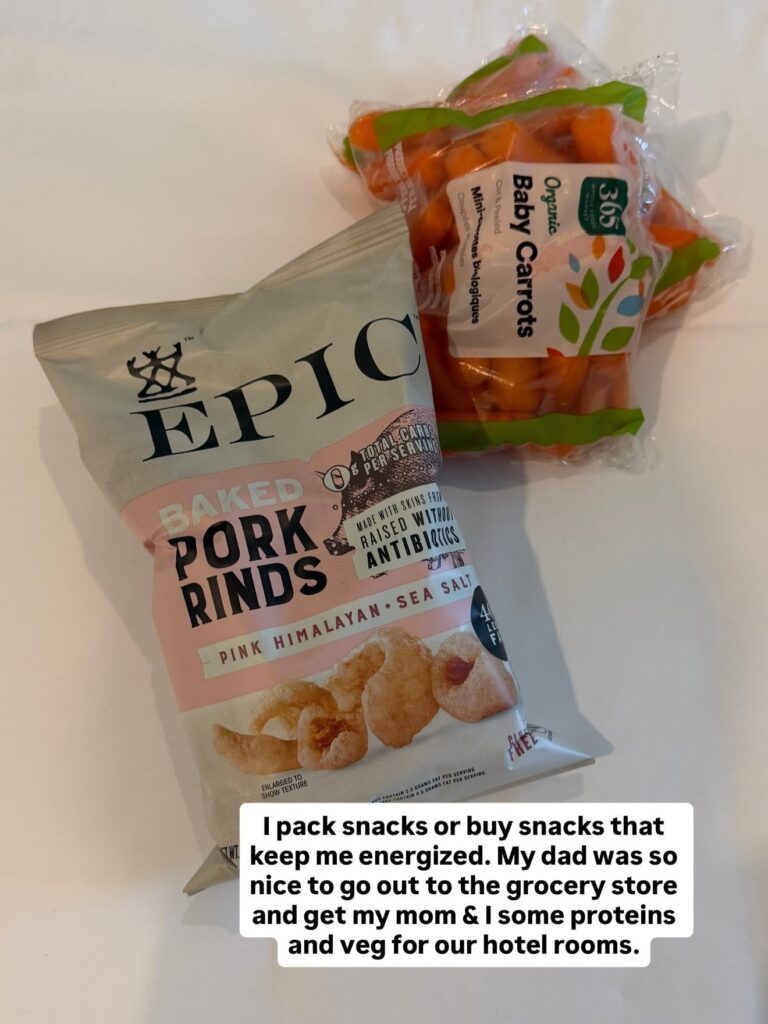 Travel snacks including protein bars, nuts, fruit, and jerky.